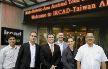 Dr, Buechel with doctors in front of hospital in Taiwan