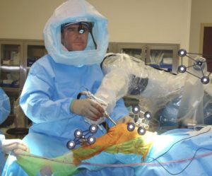 Dr. Buechel performing robotic knee replacement surgery